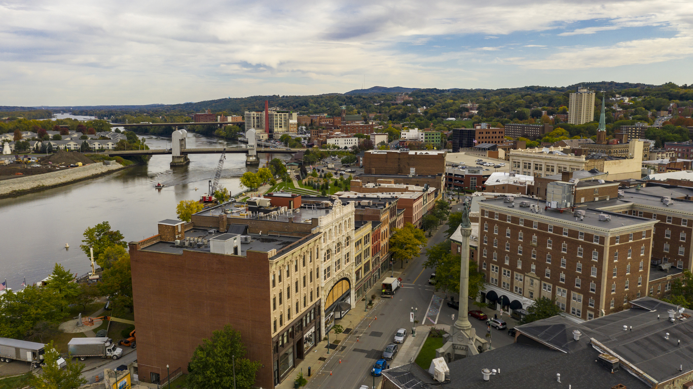 Tugboat and Downtown Troy, NY in Rensselaer County along the banks of the Hudson River
